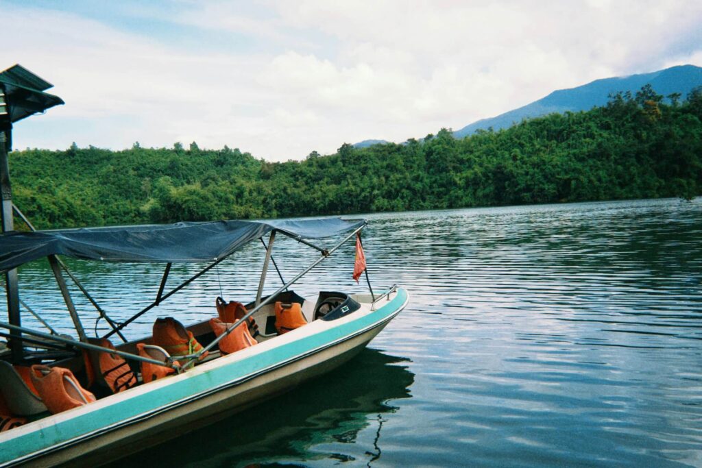 Boat tour on Gatun Lake near Monkey Island surrounded by rainforest in Panama Canal